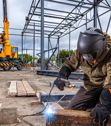 Construction-site-worker-using-a-welding-tool